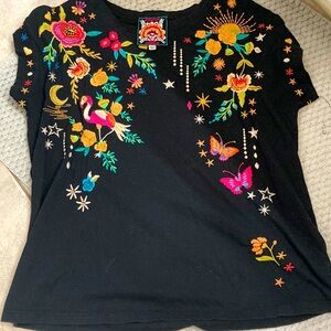 Johnny Was embroidered sleeveless 
You should try